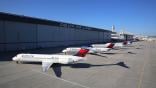 Delta Air Lines Boeing 717 aircraft parked in front of hangar
